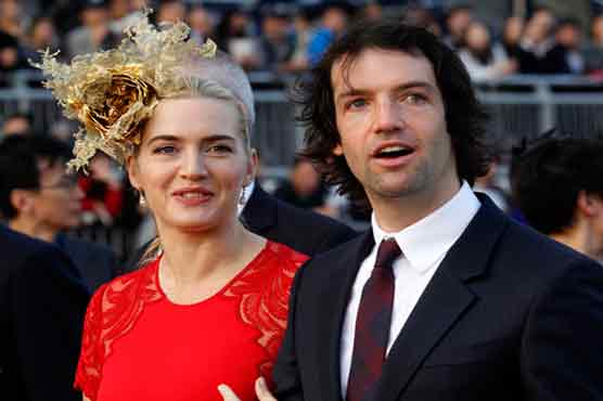 Winslet's husband fights tabloid over party photos