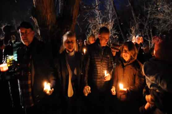 Hundreds hold vigil for elk killed by police 