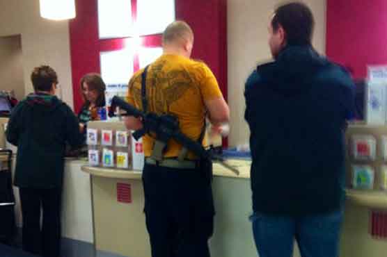 Photos of man shopping with rifle go viral