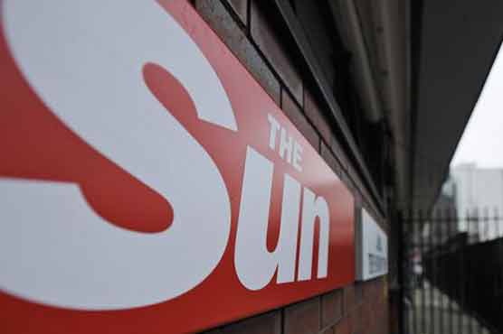 Sun journalist charged over police bribes