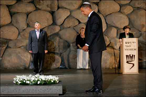 Obama vows 'never again' on Holocaust memorial day