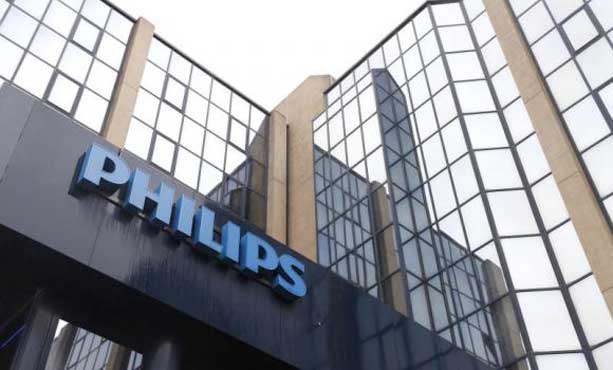 Philips loss shrinks in 4Q, sheds division