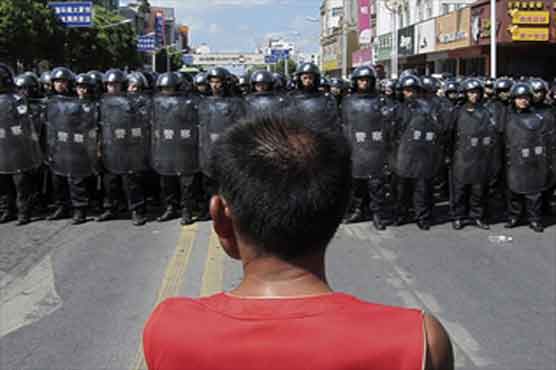 China says 14 guilty of pollution protest violence 