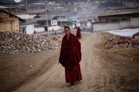 China convicts Tibetan burning 'inciters' of murder