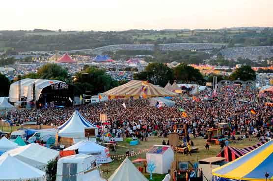 Tomato fights, anarchic gymnasts mark Glastonbury festival
