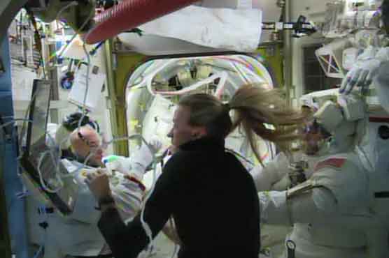 Helmet water leak aborts spacewalk; astronaut safe