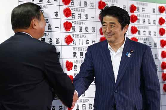 Japan's ruling bloc wins upper house elections