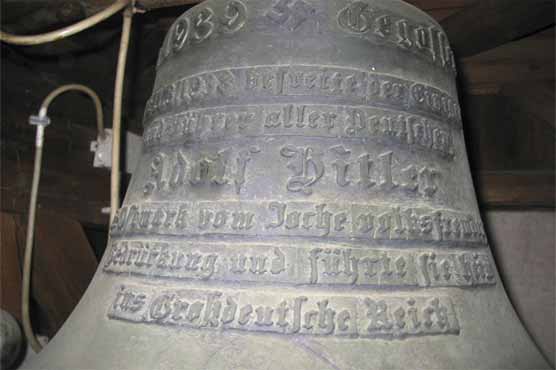 Austrian flap over bell dedicated to Hitler 