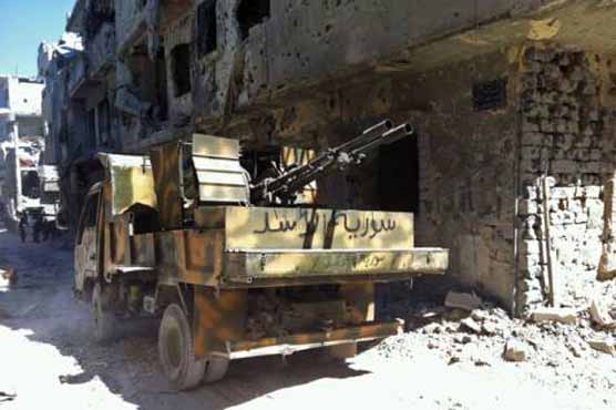 Troops capture key Homs neighborhood: Syrian media