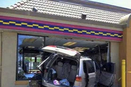 Van crashes through restaurant window