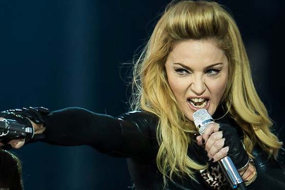 Madonna premieres tour film, talks secret project