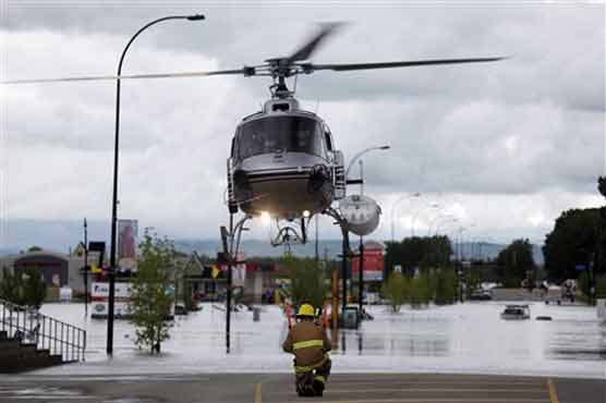 Flooding may force 100,000 from west Canada homes