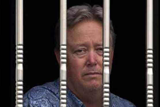 US boss held by Chinese workers awaits outcome