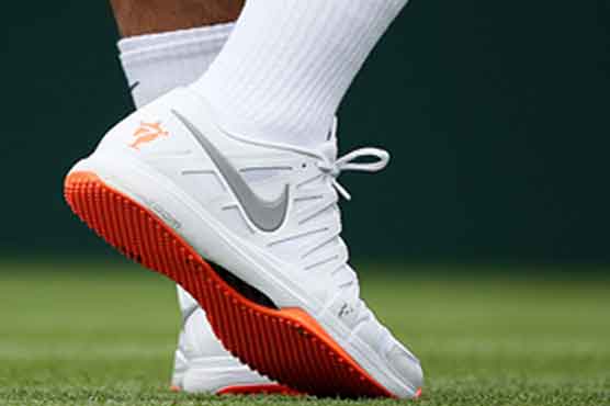 All-white rule: Federer told to change his orange-soled shoes 