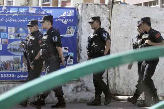 China boosts security in Xinjiang after bloodshed 