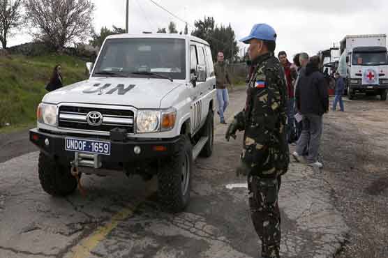 Syria rebels hand over UN peace-keepers to Jordan 