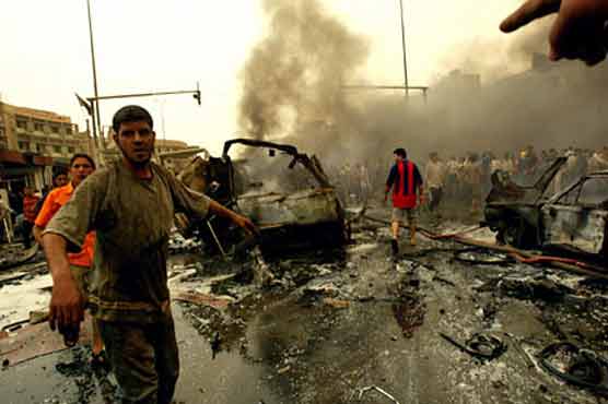 Attackers kill 12 in coordinated Baghdad assault