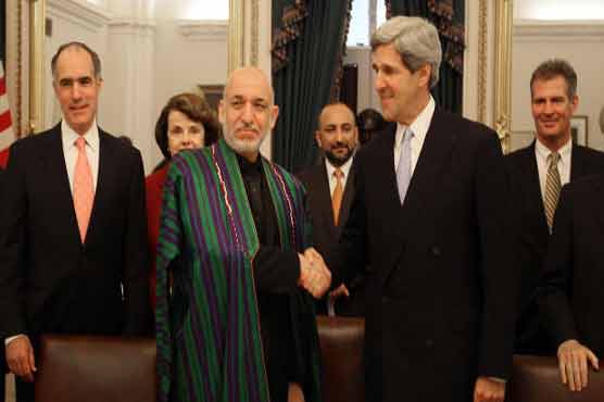 Kerry in Afghanistan to prod Karzai on future ties