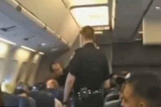 Woman singing loud song forces plane to divert 