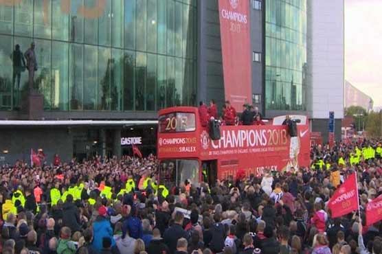 Fans celebrate United's title win during parade