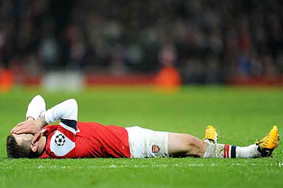 Arsenal's Wilshere to have surgery on right ankle