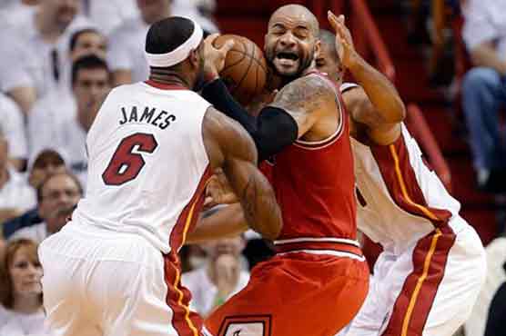 Heat rally past Bulls to advance, 94-91 