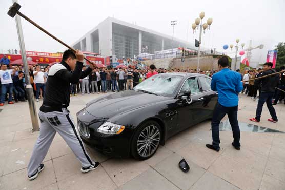 Owner smashes his Maserati in protest