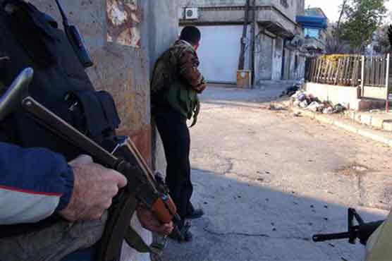 Syrian, Hezbollah troops fight rebels in key town