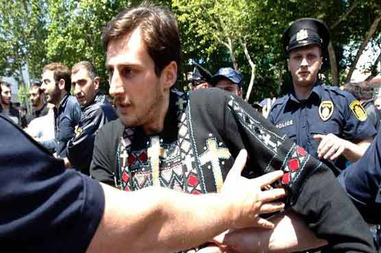 Georgia charges 2 priests for attacking gay rights rally 