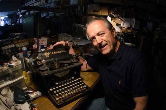 Old man yet clinging to 1930 typewriter