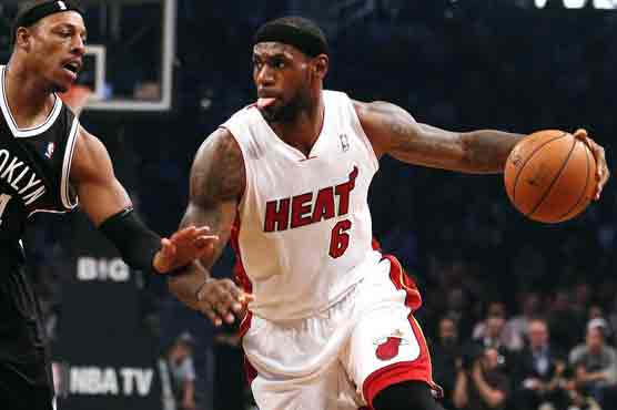 James scores double figures in 500th straight game 