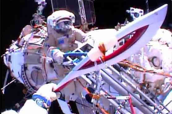 Russians take Olympic torch for space walk