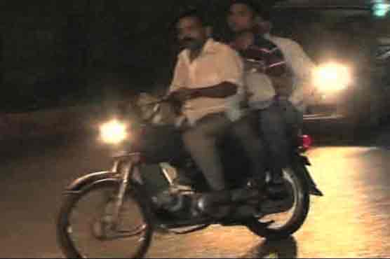 Pillion riding ban ends in Karachi
