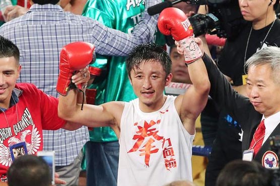 Zou wins 3rd pro fight, learns from Pacquiao