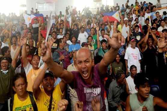Filipino typhoon survivors cheer Pacquiao triumph