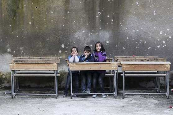 In Aleppo, schools reopen despite war