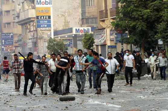 57 die in clashes as Egypt strips MB of NGO status 