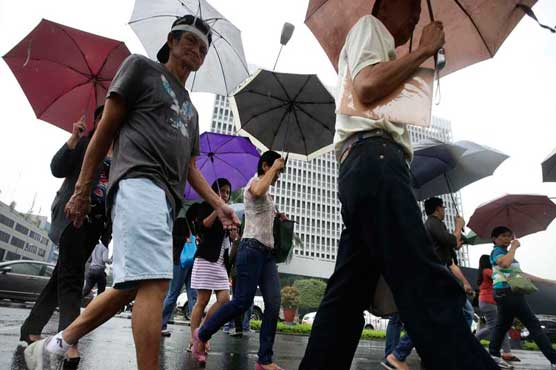 Eight dead, millions without power as typhoon hits Philippines
