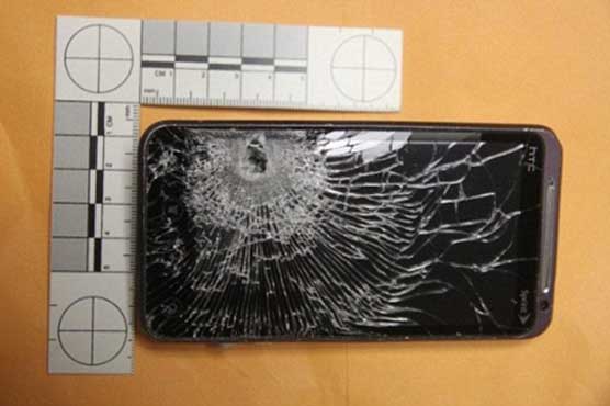 Cellphone saves store clerk from bullet