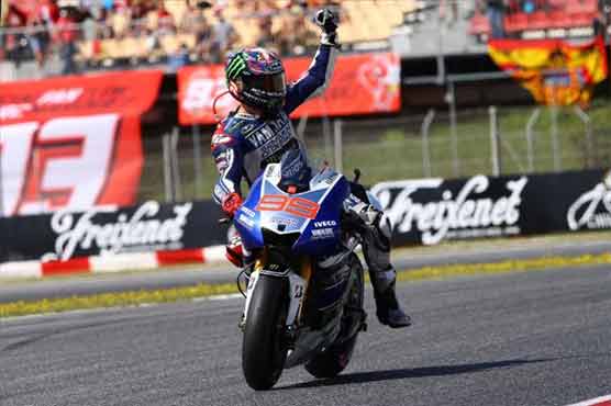 Lorenzo holds off Marquez to win British MotoGP