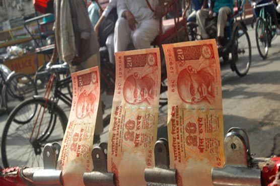 Indian rupee slides again