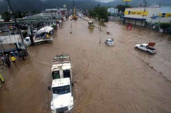 Big storms hit Mexico on opposite coasts; 21 dead