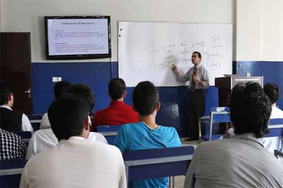 Afghans flock to colleges, even as Taliban threat looms 