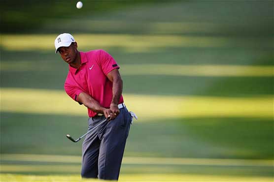 Tiger competing against his past