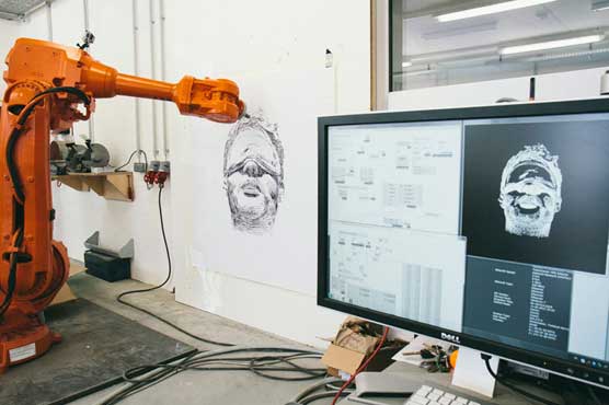Artist uses robots to create art in three cities
