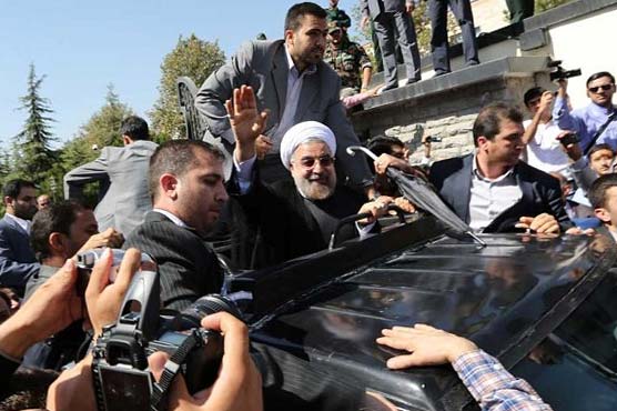Shoe thrown as Rouhani returns after historic Obama call