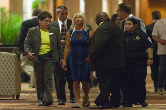 Woman accused of tossing shoe at Clinton released