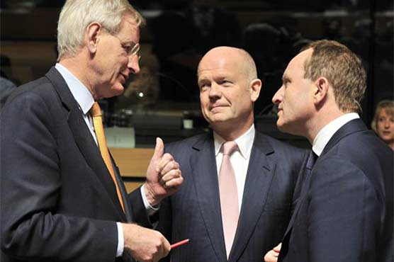 EU sees Russia's hand in Ukraine, threatens more sanctions