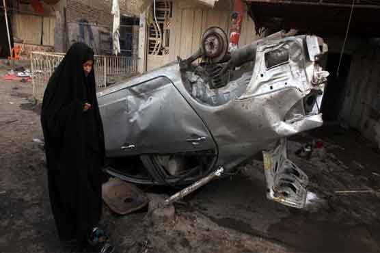 Iraq policeman dies shielding recruits, attacks kill 21