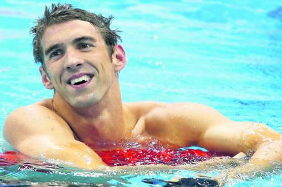 Swimming: Phelps tops 100m fly qualifying in return